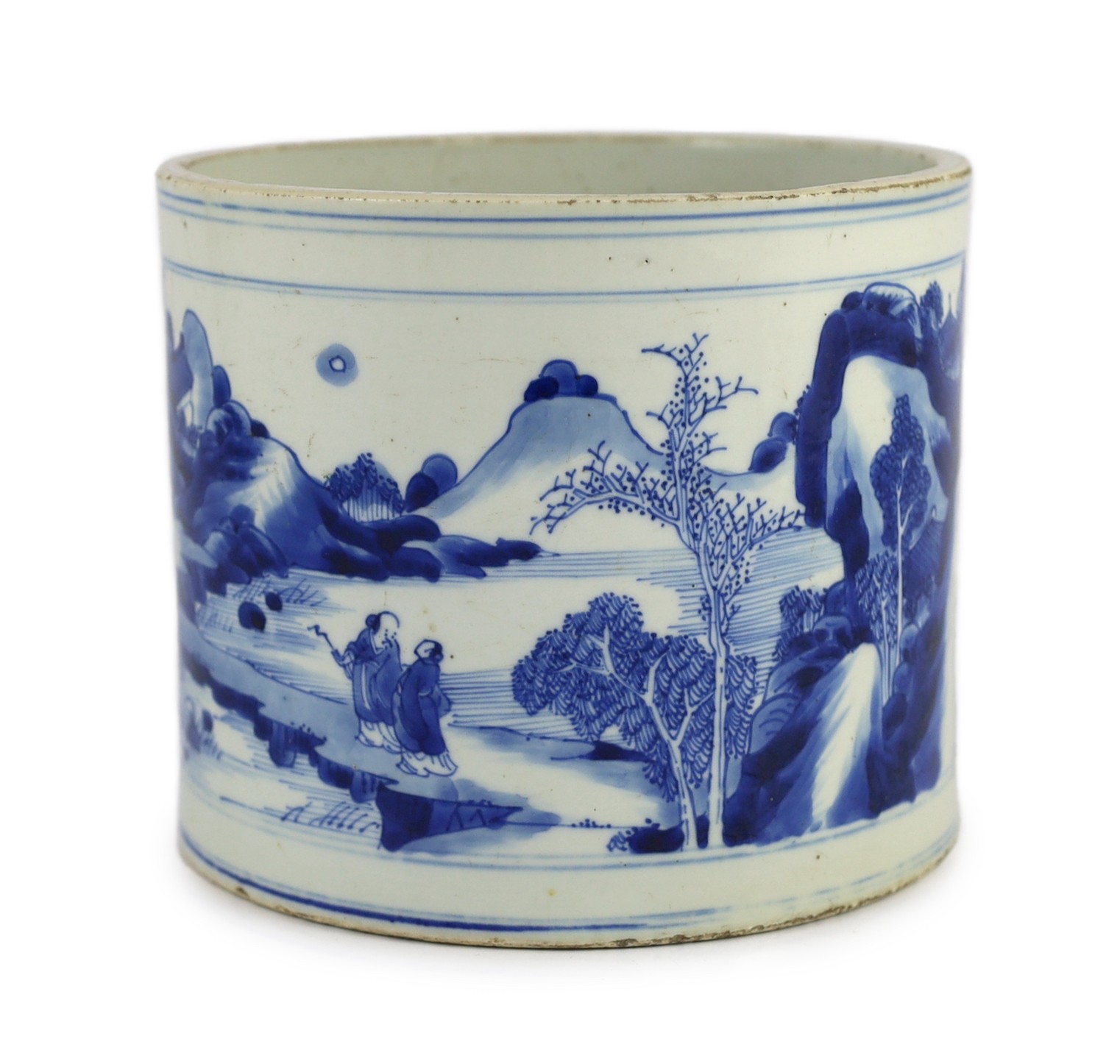 A Chinese blue and white ‘landscape’ brushpot, bitong, Kangxi period, 17.8cm diameter, 15.2cm high, fritting to edges